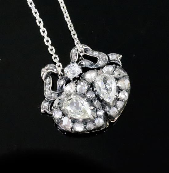 A 19th century gold, silver and diamond set twin hearts pendant, pendant 16mm.
